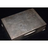 AN ART DECO SILVER CIGARETTE BOX By Goldsmiths and Silversmiths Co, engine turned decoration to