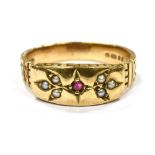 A MODERN 9CT GOLD SMALL RUBY AND SEED PEARL SET BAND RING the bead set front all in one to yellow