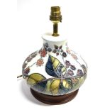 A MOORCROFT POTTERY TABLE LAMP DECORATED IN THE 'BRAMBLE' PATTERN designed by Sally Tuffin, of squat