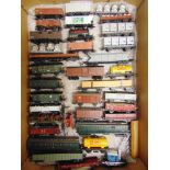 [HO GAUGE]. A MISCELLANEOUS ROLLING STOCK COLLECTION comprising wagons and coaches, some weathered