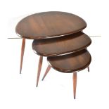 A NEST OF THREE ERCOL 'PEBBLE' OCCASIONAL TABLES model 354, the largest 65cm wide