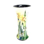 A LIMITED EDITION MOORCROFT POTTERY VASE DECORATED IN THE 'CUTLERS GREEN' PATTERN of trumpet form,