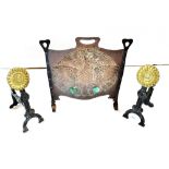 AN ARTS AND CRAFTS STYLE WROUGHT IRON AND COPPER FIRESCREEN with embossed decoration of a peacock,