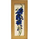A MOORCROFT POTTERY PLAQUE DECORATED WITH THE 'DELPHINIUM' PATTERN designed by Kerry Goodwin, in