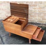 PETER HAYWARD FOR VANSON: a teak sewing box with stepped top, lifting lid and two drawers, 77cm wide