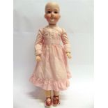 AN ARMAND MARSEILLE BISQUE SOCKET HEAD DOLL with sleeping brown glass eyes, and an open mouth with