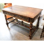 A CONTINENTAL CENTRE TABLE the rectangular top with lunette carved border, carved frieze with single