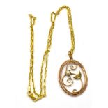 AN EDWARDIAN 9CT GOLD PEARL SET OVAL PENDANT on a later 9ct gold chain, the oval openwork rose and