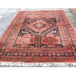 A CONTEMPORARY RED GROUND CARPET 352cm x 255cm Condition Report : no great age, but clean and