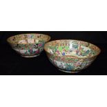 TWO CHINESE CANTON PUNCH BOWLS each painted with figures in court setting in the Famille Verte