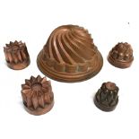 A VICTORIAN COPPER JELLY MOULD 21cm diameter 10cm high; a pair of small jelly moulds 7cm diameter