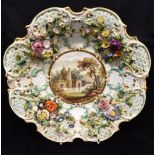 A 19TH CENTURY ENGLISH SOFT PASTE PORCELAIN SHALLOW DISH painted with a lakeland castle to centre,