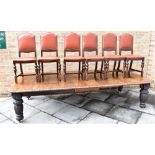 LATE 19TH CENTURY OAK DINING TABLE, with a floral decorated rim together with extra leaf and winder,