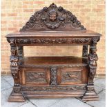 19TH CENTURY CARVED OAK BUFFET, with a carved domed shaped raised back depicting a female head to