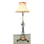 A WROUGHT IRON AND COPPER TELESCOPIC LAMP STANDARD converted from an oil lamp stand Condition Report