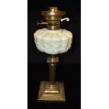A LATE VICTORIAN/EDWARDIAN OIL LAMP BASE the opaque glass reservoir with moulded decoration, on