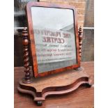 19TH CENTURY MAHOGANY SWING FRAME MIRROR, between turned columns and raised on a shaped base 70cm