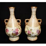 A PAIR OF ROYAL BONN PORCELAIN TWIN HANDLED VASES with floral and gilt decoration, 26cm high