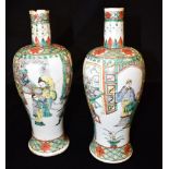 A PAIR OF CHINESE VASES OF BALUSTER FORM with elongated necks, decorated in the Famile Verte palette