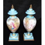 A PAIR OF 19TH CENTURY FRENCH PORCELAIN VASES polychrome enamelled with scenes of a courting