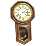 AN AMERICAN DROP-DIAL WALL CLOCK WITH 8-DAY MOVEMENT by the Ansonia Clock Company New York, the