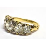 A 5 CARAT LATE VICTORIAN/EDWARDIAN FIVE STONE RING the round/off round old cut diamonds graduating