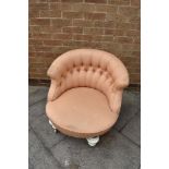 VICTORIAN TUB CHAIR in pink and floral upholstery and with later addition of a swivel base with