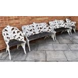 A PAIR OF COALBROOKDALE 'FERN AND BLACKBERRY' STYLE CAST METAL GARDEN BENCHES, together with a