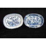 TWO CHINESE EXPORT OVAL DISHES each with underglaze blue painted decoration of garden scenes, 28cm