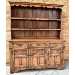 20TH CENTURY LIGHT OAK DRESSER, the upper section with a moulded cornice, above a two tier open