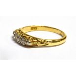 A DIAMOND 5 STONE 18CT YELLOW GOLD RING The boat shaped head claw and bead set with 5 small old