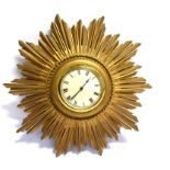 A GILT SUNBURST WALL CLOCK with Abec mechanical movement, 35cm diameter Condition Report : currently