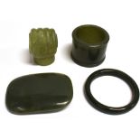 FOUR CHINESE JADE/JADEITE ITEMS including a buckle 7cm wide, an L-shaped bracket modelled as a