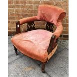 AN EDWARDIAN STAINED BEECH TUB CHAIR the horseshoe back supported by three carved splats, on