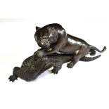 A JAPANESE MEIJI/TAISHO PERIOD BRONZE GROUP of a tiger attacking a crocodile, the tiger with
