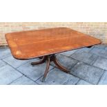 MAHOGANY AND CROSSBANDED RECTANGULAR TILT TOP BREAKFAST TABLE on turned column with four splayed
