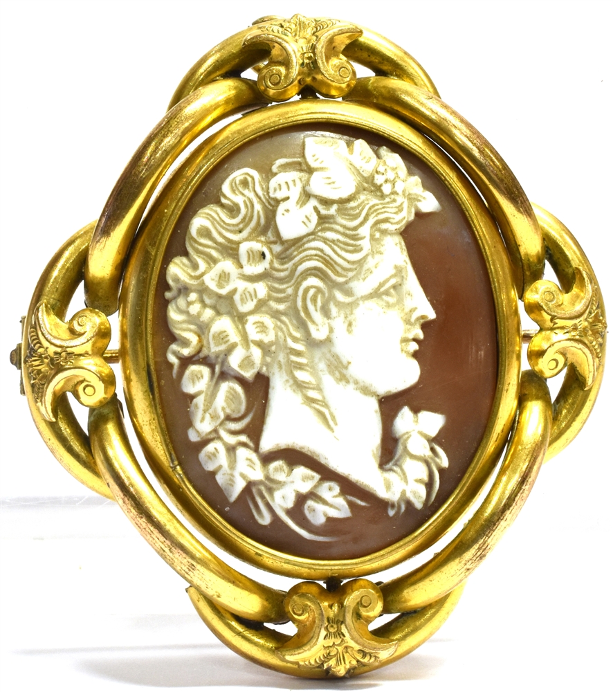 A VICTORIAN LARGE YELLOW METAL SWIVEL BROOCH the central oval swivel comprising a shell cameo