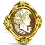A VICTORIAN LARGE YELLOW METAL SWIVEL BROOCH the central oval swivel comprising a shell cameo
