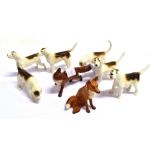 SIX BESWICK FIGURES OF HOUNDS Also a Beswick running fox and another seated. (A/F) (8)