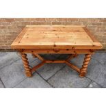 20TH CENTURY PINE DRAW LEAF DINING TABLE raised on barley twist legs, united by a stretcher and
