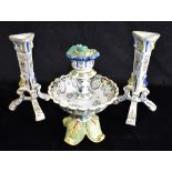 A FAIENCE CANDLESTICK WITH LARGE DRIP TRAY 23cm high, and two matching faience candlesticks with