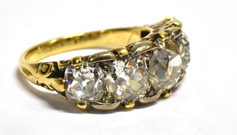 A 5 CARAT LATE VICTORIAN/EDWARDIAN FIVE STONE RING the round/off round old cut diamonds graduating - Image 3 of 4