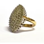 AN OVAL DIAMOND CLUSTER RING 9ct gold ring with small round brilliant cut diamonds with a total