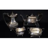 A SILVER FOUR PIECE TEA SET Comprising teapot, large lidded water jug, sugar bowl and milk jug of