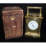 A GILT METAL CASED CARRIAGE CLOCK WITH REPEAT MECHANISM striking the hours and half hours on a