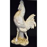 A VERY LARGE CERAMIC FIGURAL STICKSTAND naturalistically modelled as a cockerel standing by a sheath