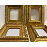FOUR GILT GESSO PICTURE FRAMES: a pair with fruit and leaf moulded decoration, apertures 15.5cm x