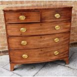 A 19TH CENTURY MAHOGANY BOWFRONT CHEST OF TWO SHORT AND THREE LONG DRAWERS on splayed bracket