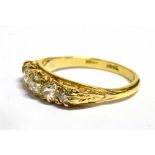 A DIAMOND FIVE STONE 18CT GOLD RING the boat shaped head claw set with five graduating round old cut