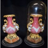 A PAIR OF CONTINENTAL GILT METAL MOUNTED OPAQUE GLASS VASES the cased glass bodies with engraved